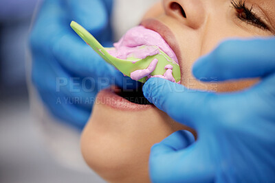 Buy stock photo Shot of a young woman having dental work done on her teeth