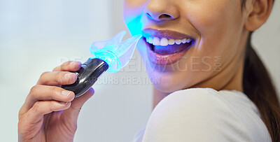 Buy stock photo Shot of an unrecognisable  woman having her teeth whitened at the dentist
