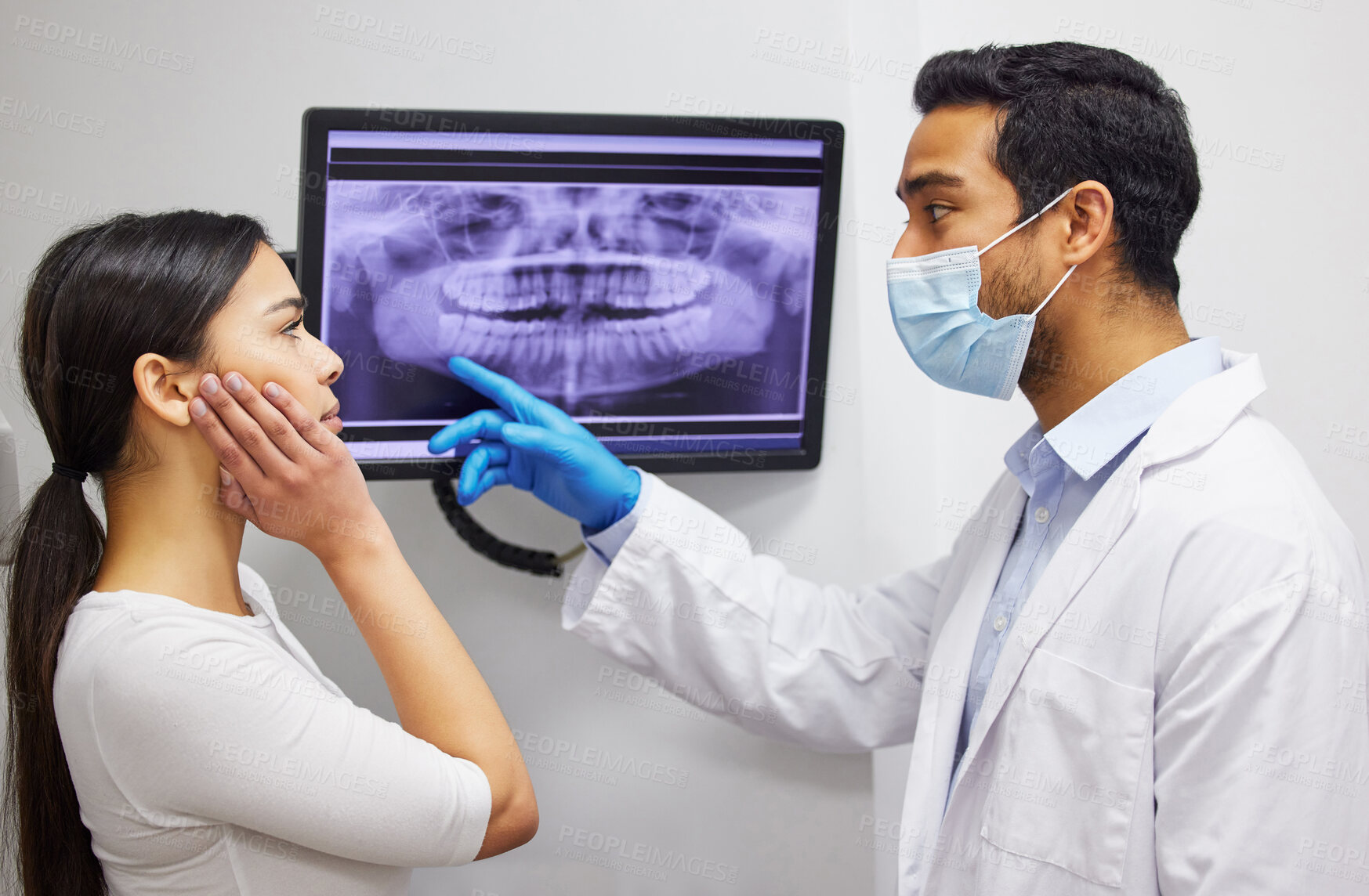 Buy stock photo Dentist, communication and x ray of teeth on screen for patient education, dental diagnosis and treatment planning. Oral assessment, person and monitor for mouth scan for hygiene, health and wellness