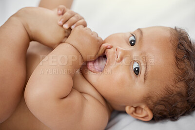 Buy stock photo Baby, portrait and child play with feet on bed in home having fun and enjoying time alone. Face, newborn and playing with foot, toes and cute infant, kid or toddler with growth, development and relax