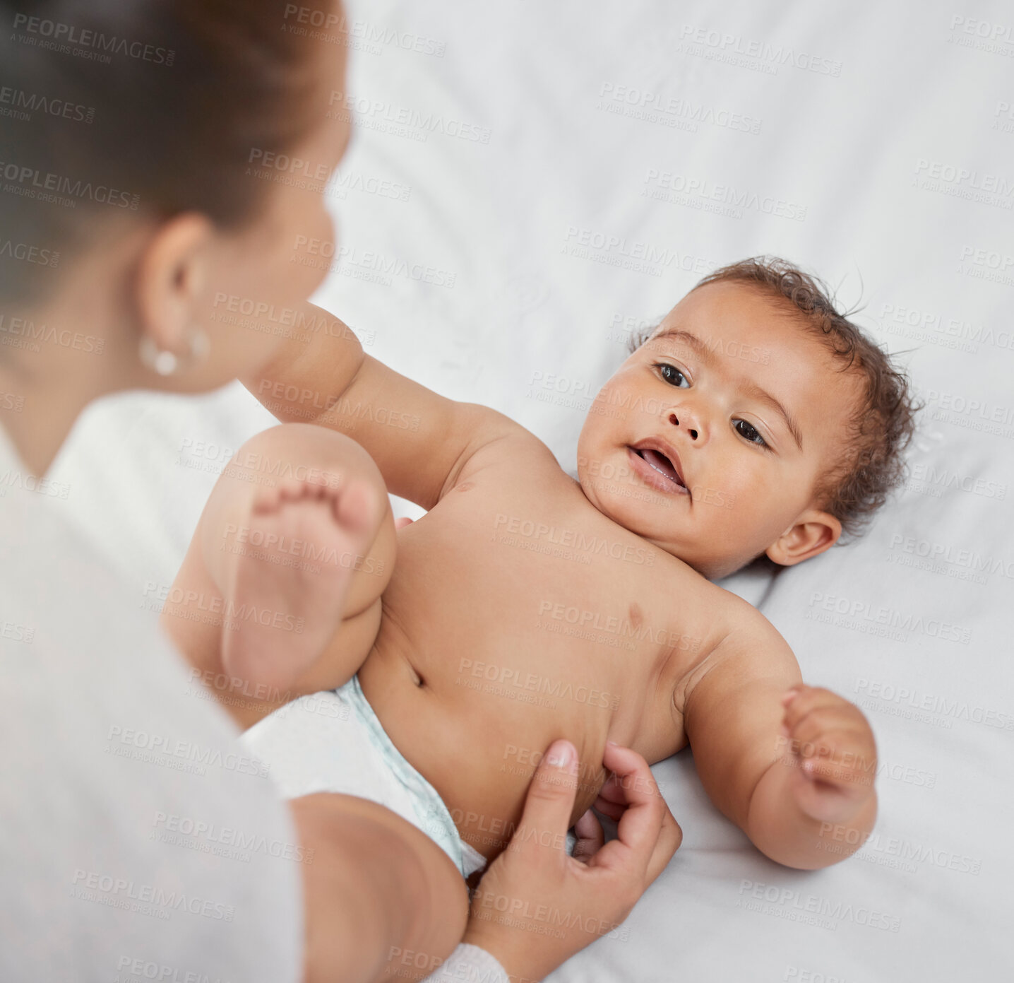 Buy stock photo Mother, baby and bonding in home, tickle and love for infant or support in child development. Mommy, playing and boy for affection or care in bedroom, security and connect in relationship or comfort