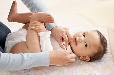 Buy stock photo Happy baby, girl and mother in diaper change with care, happiness and playing in home for development. Cheerful, child and woman for bonding, motor skills and nurture for health, hygiene and comfort