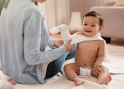 Buy stock photo Mom, baby and happy with dressing in home for care, support and child development or growth. People, parent and toddler or infant with smile on floor for fun, bonding and trust with excitement