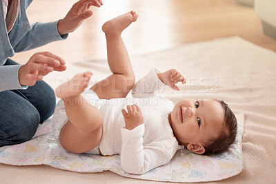 Buy stock photo Happy child, infant and woman in diaper change with care, happiness and play in home for development. Cheerful, baby and mother for bonding, motor skills and nurture with health, hygiene and comfort