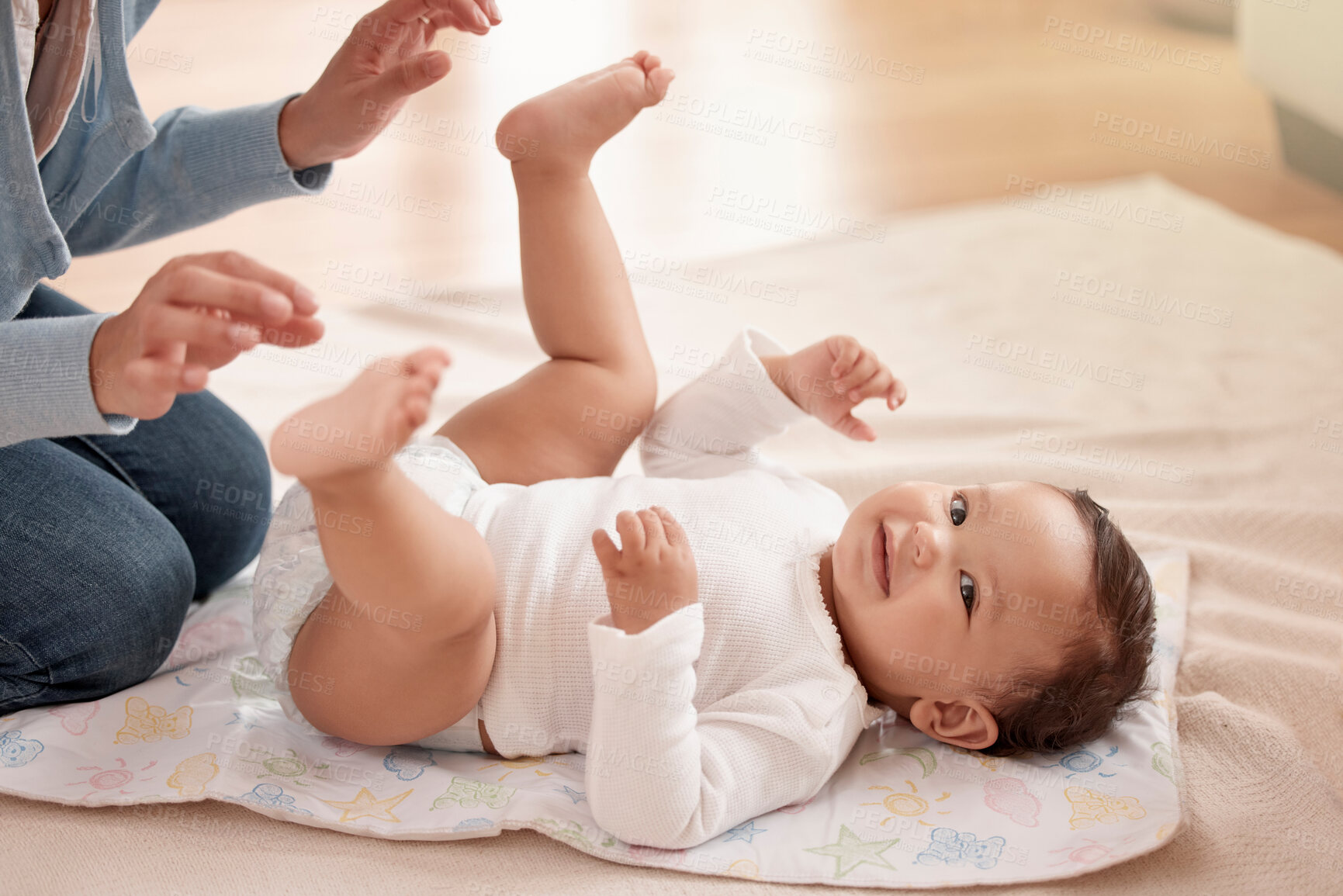 Buy stock photo Happy child, infant and woman in diaper change with care, happiness and play in home for development. Cheerful, baby and mother for bonding, motor skills and nurture with health, hygiene and comfort