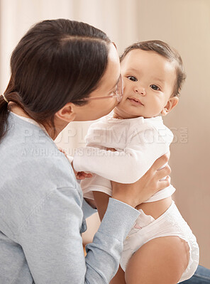 Buy stock photo Mom, baby and bonding with kissing at home for care, support and child development or growth. People, parent and toddler or infant for fun, security and trust with comfort for love and relax