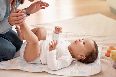 Buy stock photo Happy baby, girl and mother for diaper change, care and playing in home or nursery for child development. Cheerful infant, woman and bonding in motor skills, nurture and health for hygiene or comfort