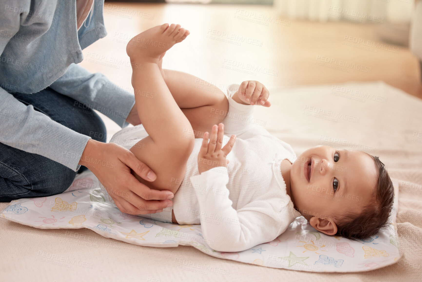 Buy stock photo Happy baby, girl and woman in diaper change with care, happiness and playing in home for development. Cheerful, child and mother for bonding, motor skills and nurture with health, hygiene and comfort