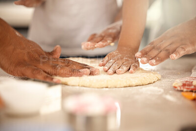 Buy stock photo Cropped shot of an unrecognizable girl using a cookie cutter while making cookies at home