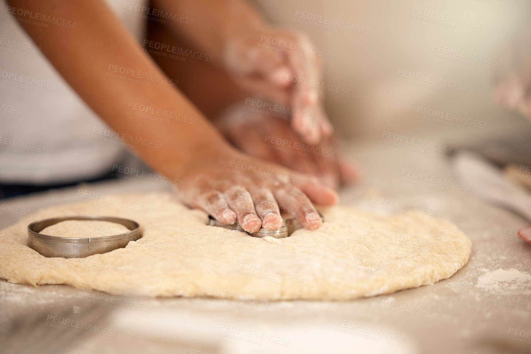 Buy stock photo Hands, dough and cookie cutter in kitchen for baking, together and dessert for nutrition. Food, chef and flour or cooking for party or birthday and wellness in home with recipe, sweets and snack