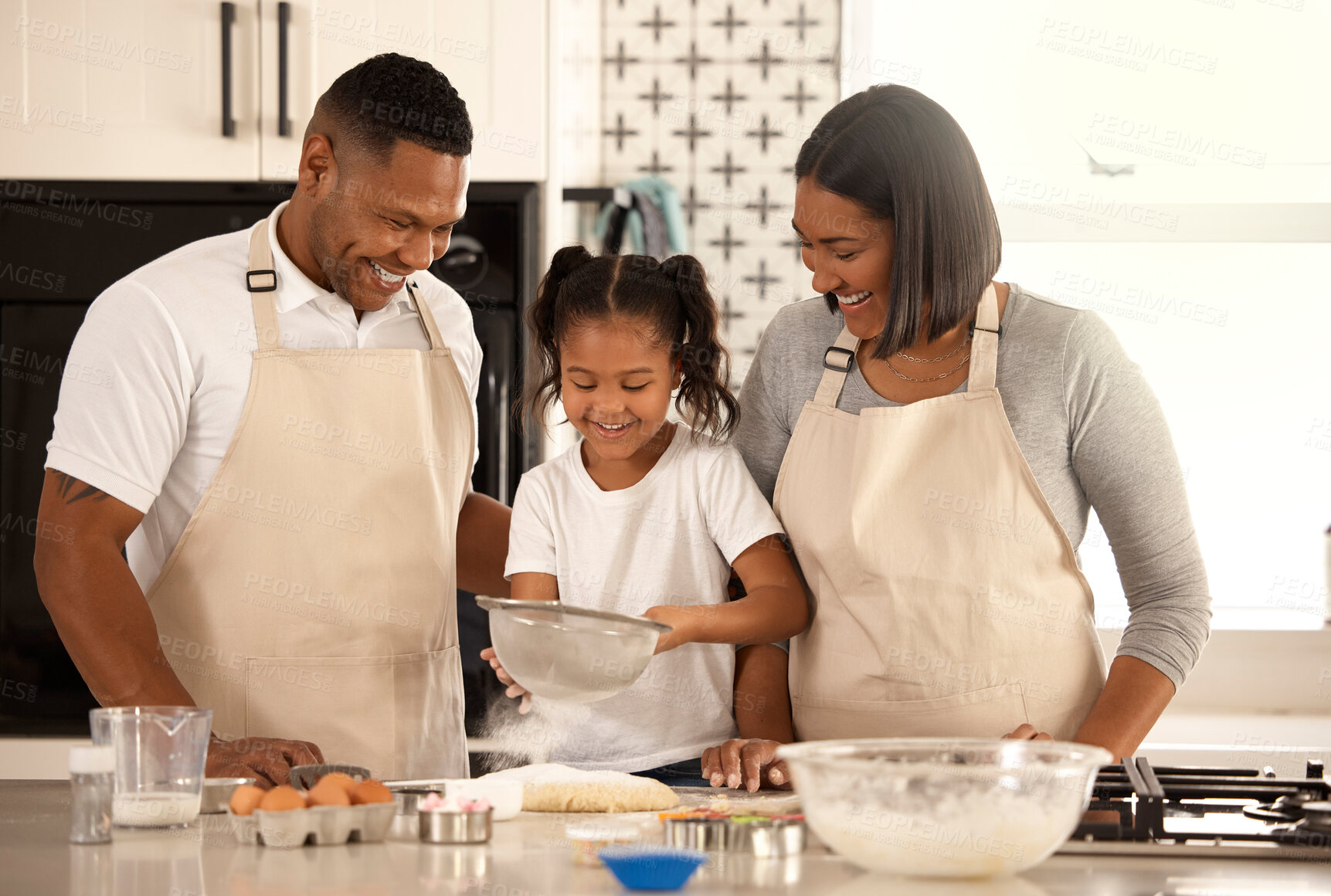 Buy stock photo Family, kid and parents baking with flour in kitchen for learning, help and teaching girl. Happy mother, father and child with sifter for dessert recipe, cake or cooking food with ingredients in home