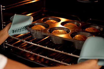 Buy stock photo Muffins, oven and hands with tray for baking, culinary skills with kid in home with mitts on for heat safety. Caution, weekend break and cupcakes recipe or child development, fresh treat and kitchen