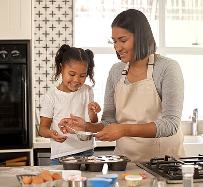 Buy stock photo Mom, child and baking cupcake in kitchen for learning, help and teaching girl. Happy mother, kid and cooking with muffin dough for dessert recipe, pastry and food with ingredients in family home