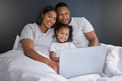 Buy stock photo Happy family, girl and online with laptop in bedroom for chill or unwind on weekend, morning and relax for movies. Mother, father and child in home with internet for streaming, video and cartoon film