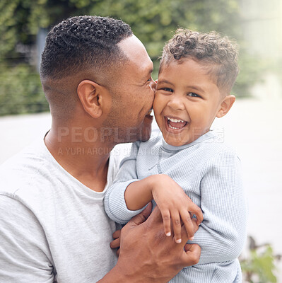 Buy stock photo Shot of an adorable little boy having fun with his father in a garden