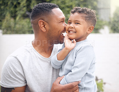 Buy stock photo Shot of an adorable little boy having fun with his father in a garden