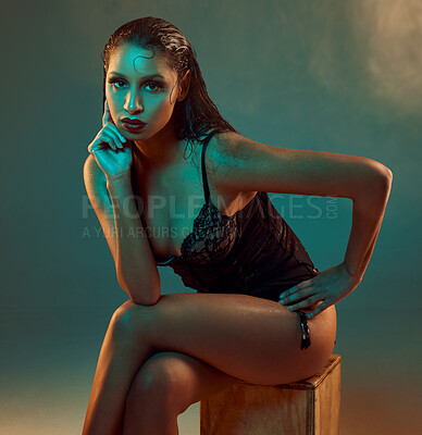 Buy stock photo Portrait, lingerie and woman sitting with studio background for confidence, elegant or sensual style. Body, wet skin and female model on crate for sexy fashion, aesthetic or trendy underwear