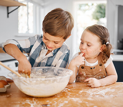 Buy stock photo Shot of a little girl and boy licking the bowl while baking together at home
