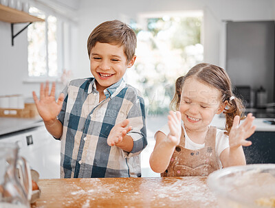 Buy stock photo Shot of a little girl and boy having fun while baking together at home