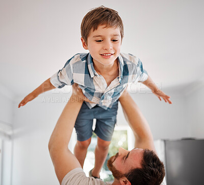 Buy stock photo Shot of a man lifting his son in the air