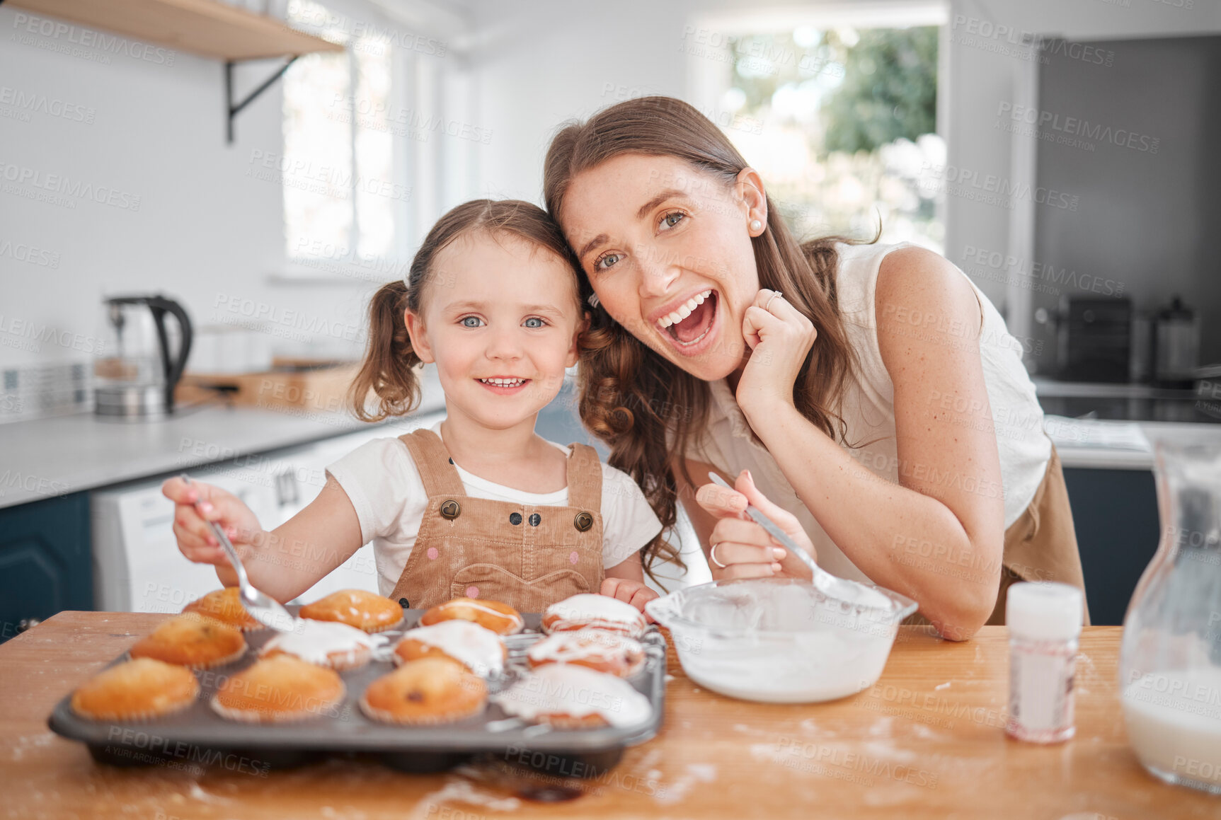 Buy stock photo Baking, portrait and decorating with mother, daughter and learning cooking in home kitchen. Food, kids and help with girl and mom happy with muffins, cupcakes and icing results for bonding together