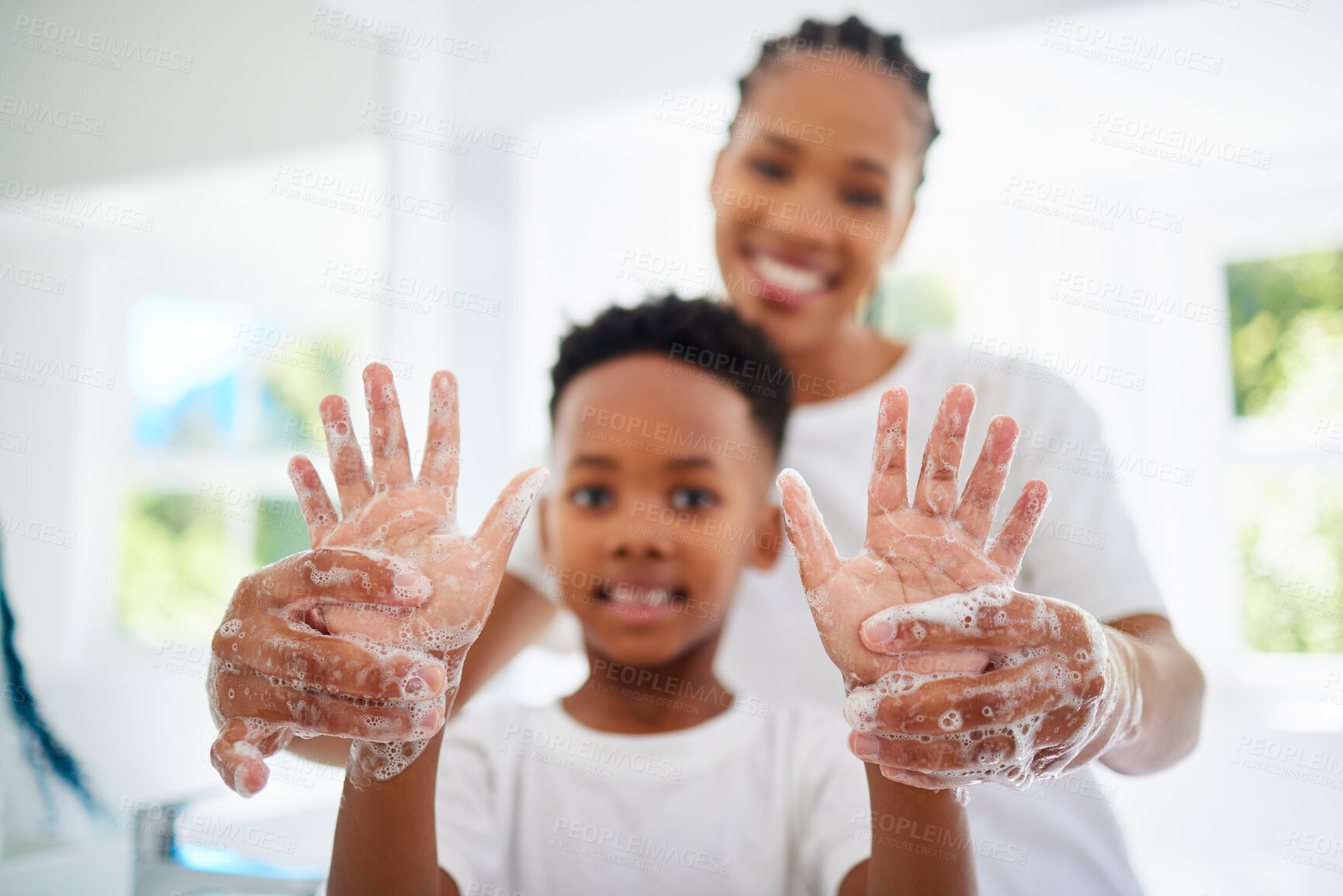 Buy stock photo Black mom, boy and smile for hands with soap in home for hygiene, care and support with child development. Parent, kid and happy or excited on portrait with handwashing for germs and bacteria