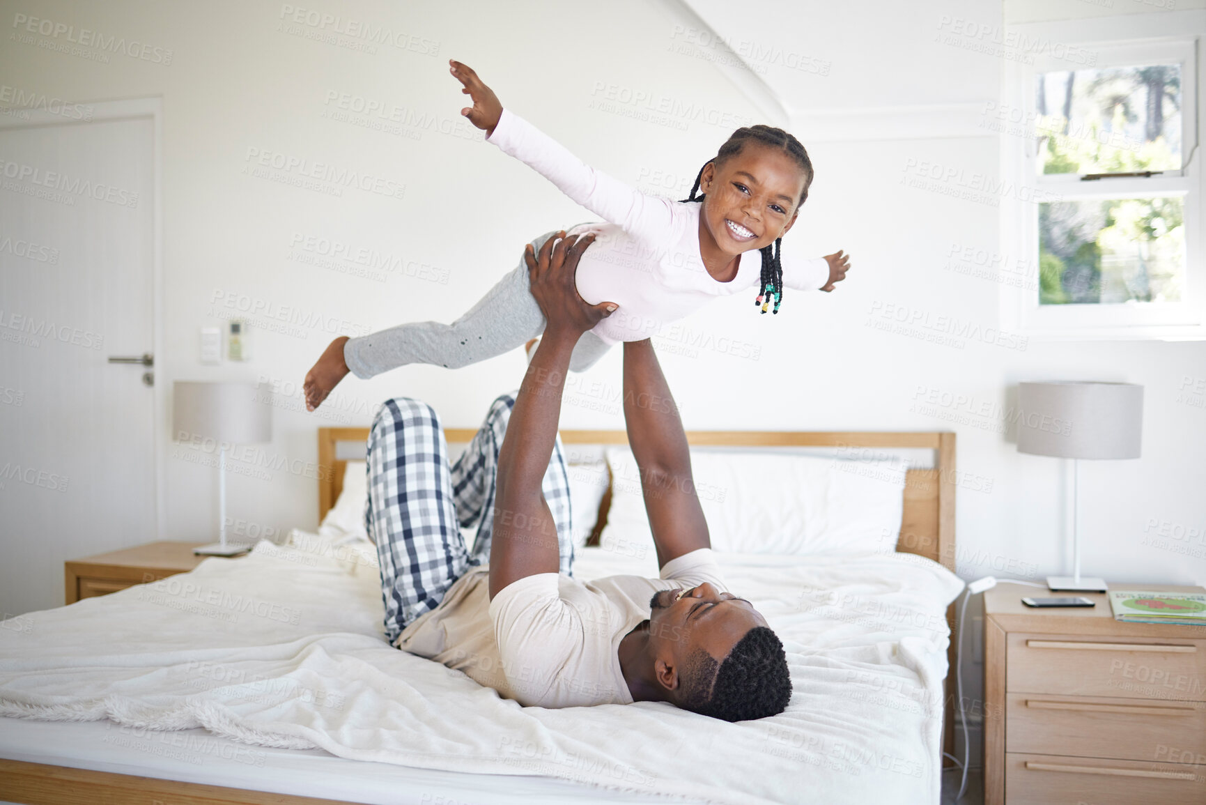 Buy stock photo Airplane, daughter and dad in home, fun and bonding in break of weekend, bedroom and games for family. House, man and girl with smile, happy and energy for playing with parent, trust and balance