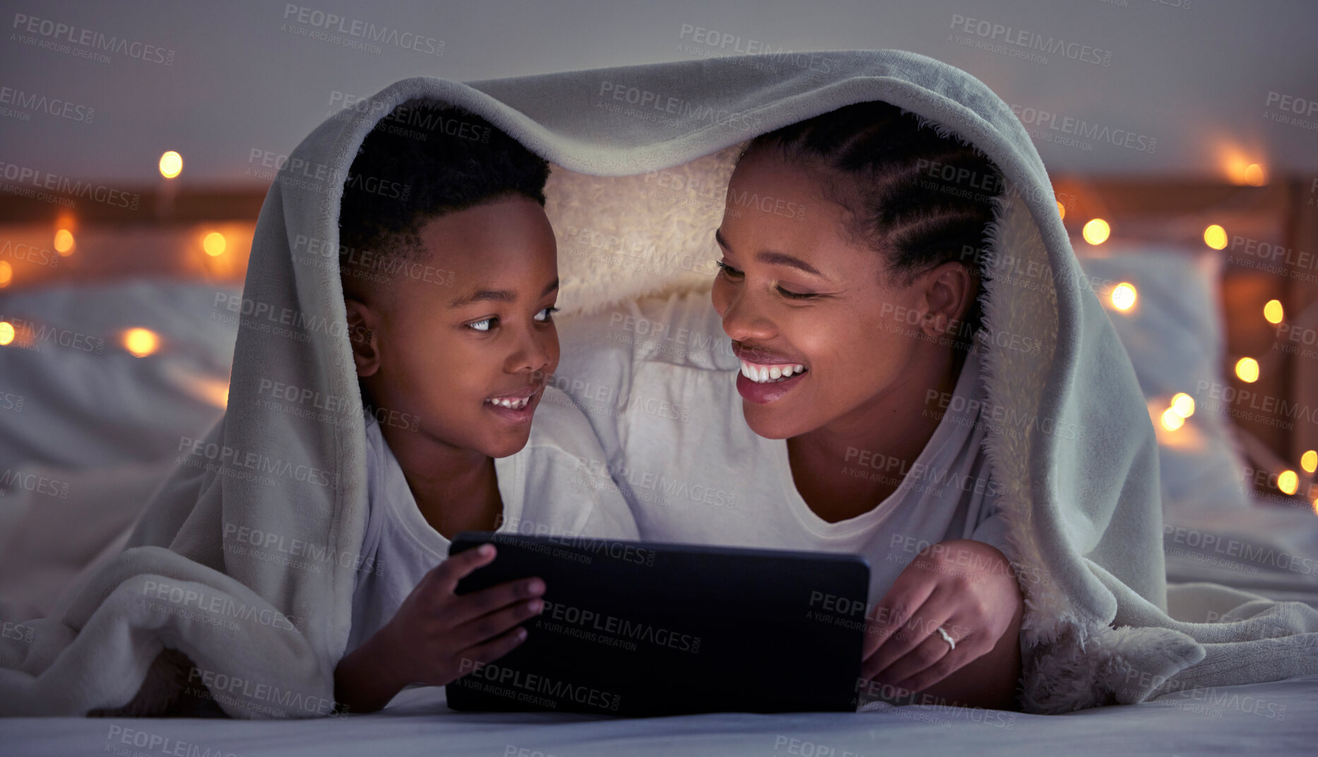 Buy stock photo Mom, son and home with tablet at night for streaming, together with led light for web game. Black parent, boy child and ebook with internet in bedroom for video, online app for learning with digital