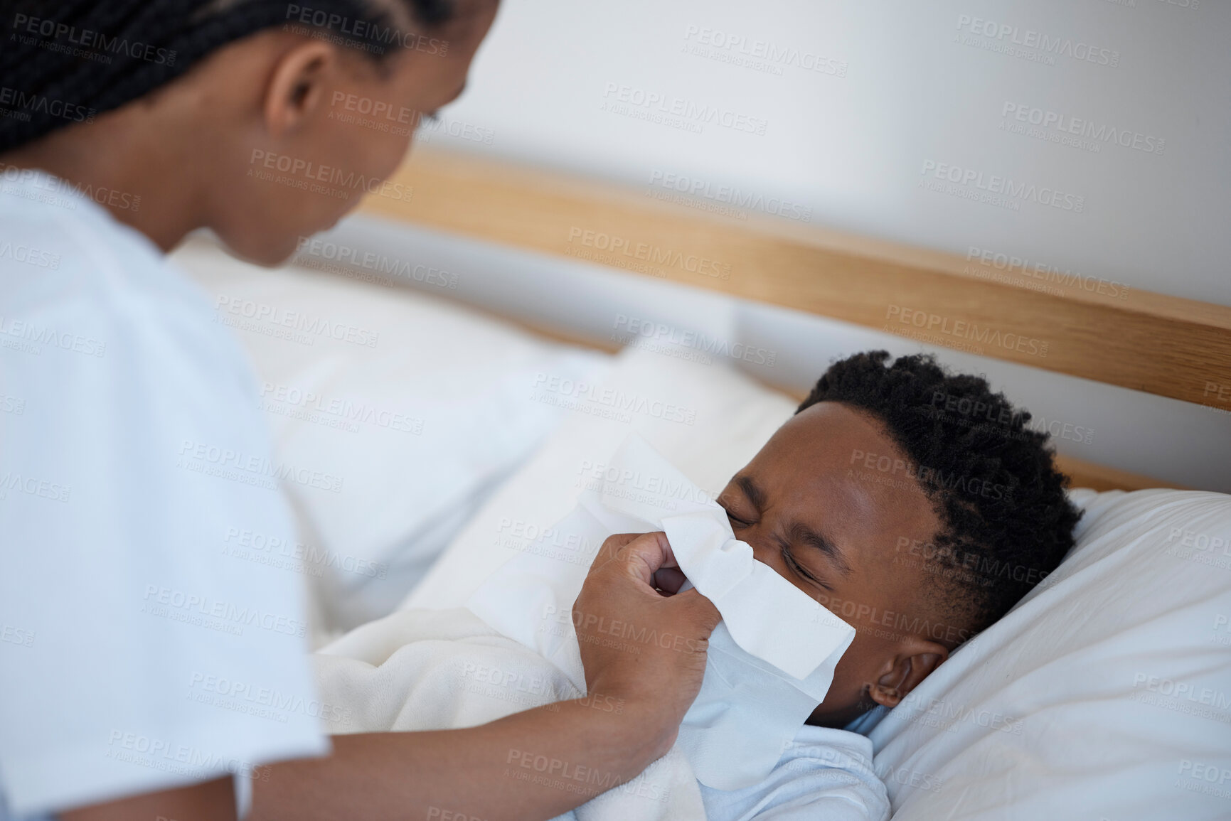 Buy stock photo Mom, boy and sick with blowing nose in bedroom with support, love and care with tissue for sinus. Black family, parent and kid at home with worry or stress for illness, flu and infection or virus