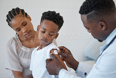 Buy stock photo Sick, black boy and healthcare in clinic with mom and plaster for child by doctor, injection and treatment. Hospital, medical and checkup with vaccine for flu, healthy and wellness of kid with mother