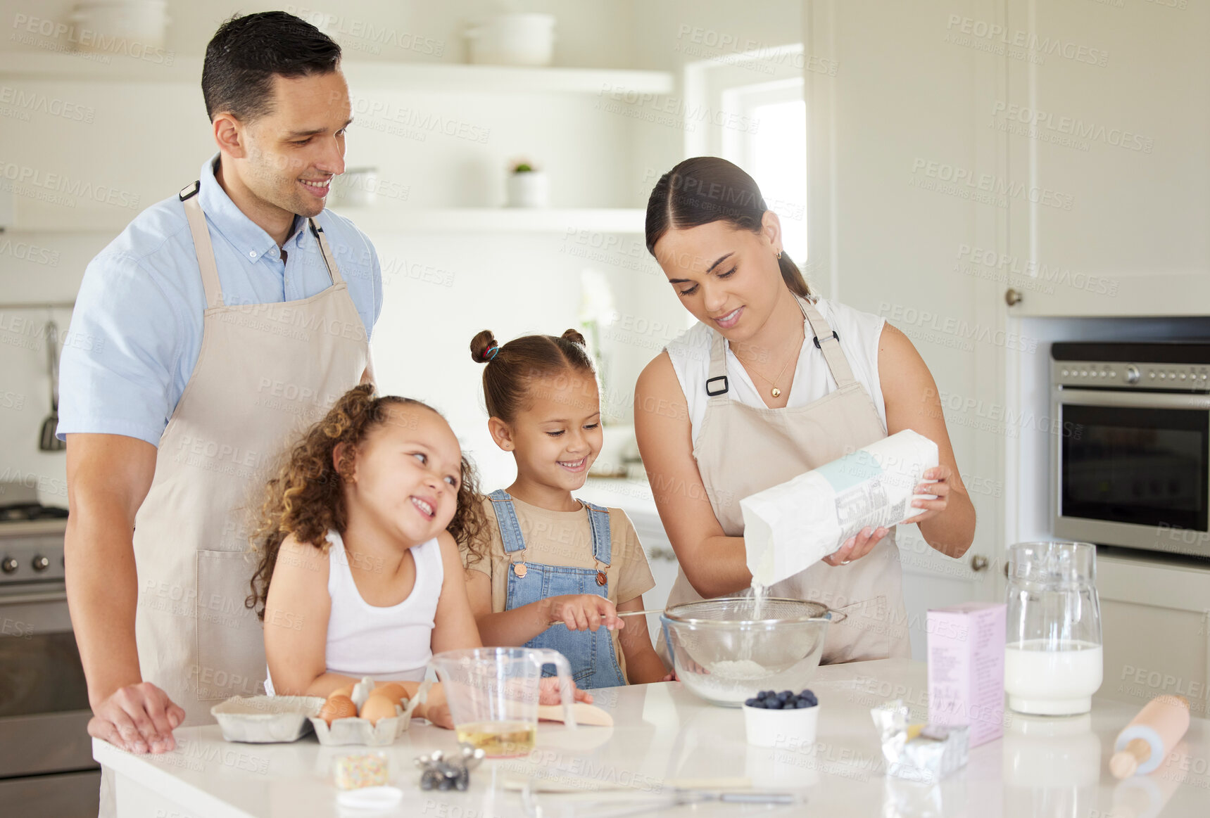 Buy stock photo Family, teaching and baking in kitchen for bonding, happy and learning with smile, flour and bowl. Mother, children and man in house for cooking, help and development with eggs, milk and oil or wheat