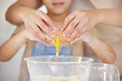 Buy stock photo Shot of an unrecognizable parent and child baking together at home