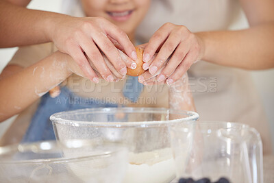Buy stock photo Shot of an unrecognizable parent and child baking together at home