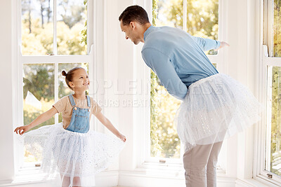 Buy stock photo Shot of an adorable young girl and her father playing dress-up and dancing at home