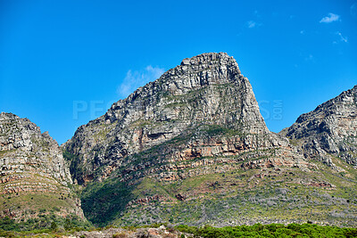 Buy stock photo Landscape, mountain view and blue sky of Twelve Apostles with copy space in remote countryside hiking terrain. Scenery of famous landmark in an environmental nature reserve in Cape Town, South Africa