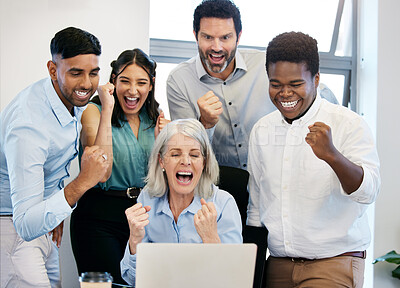 Buy stock photo Shot of a group of businesspeople cheering while using a laptop together in an office