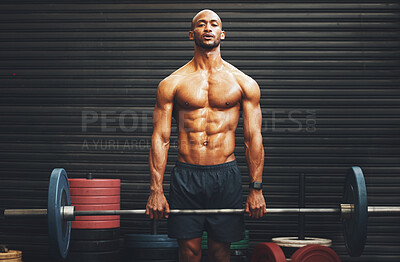 Buy stock photo Portrait of a muscular young man exercising with a barbell in a gym