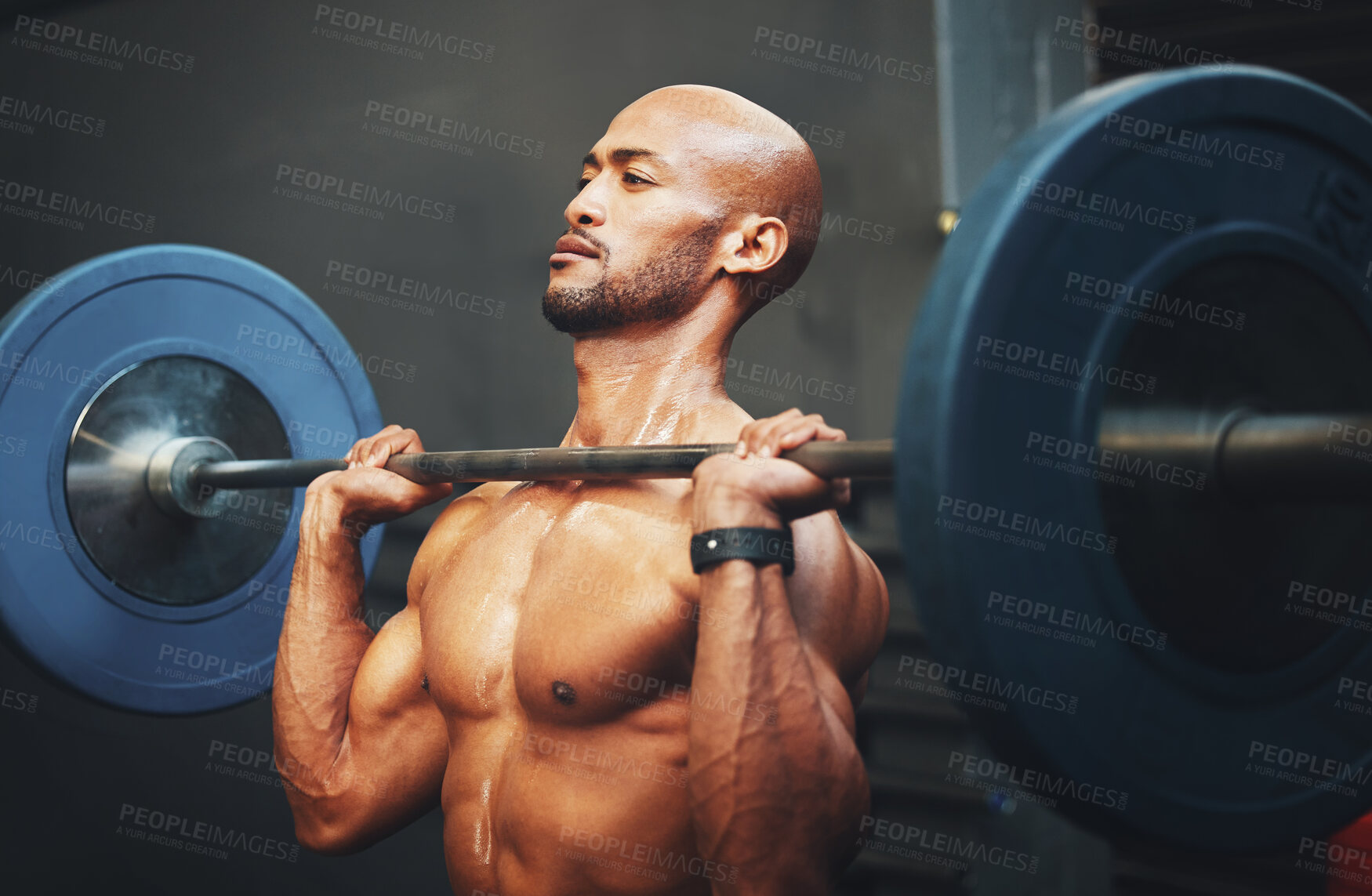 Buy stock photo Man, athlete and sports with weightlifting, fitness and barbell for strong muscle in gym. Male person, exercise and topless in wellness, bodybuilding and training for workout, endurance and challenge