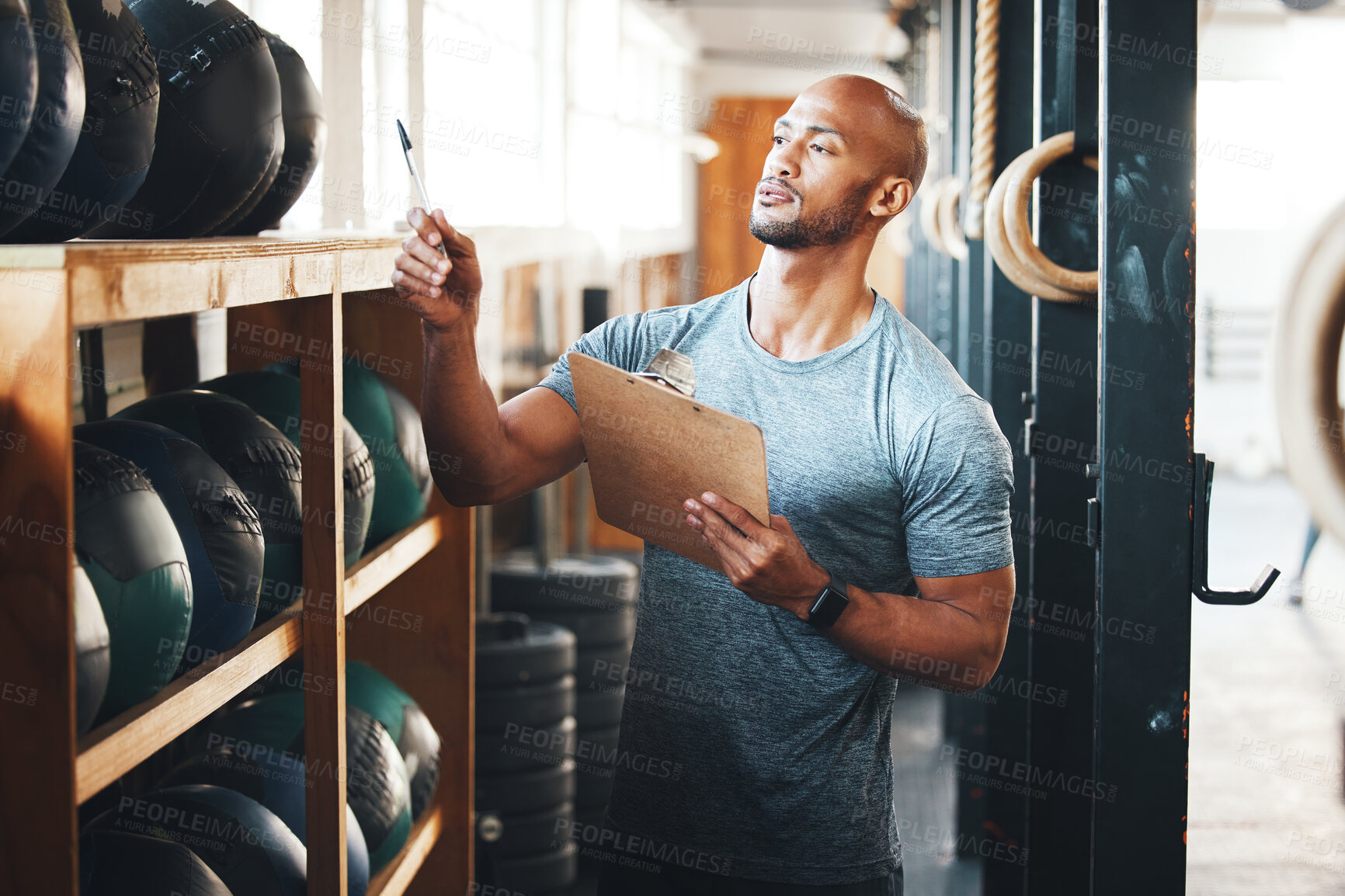 Buy stock photo Planning, clipboard and checklist with man in gym for fitness instructor, inventory and membership record. Workout schedule, personal trainer and equipment supervisor with person in health facility