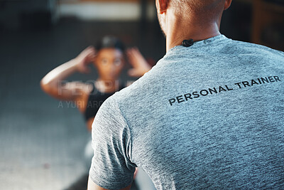 Buy stock photo Closeup shot of a personal trainer assisting a client in a gym