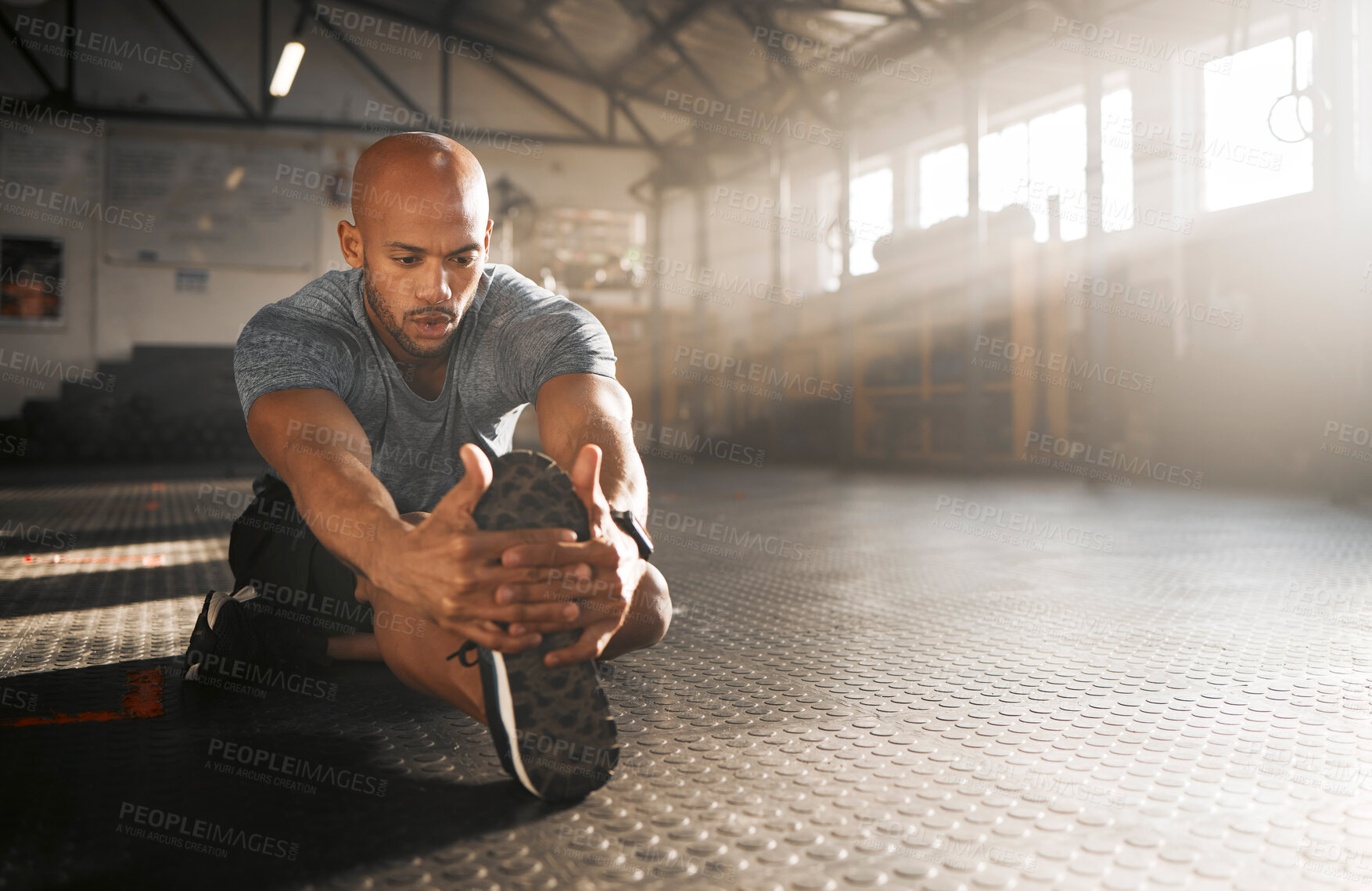 Buy stock photo Gym, man and legs with stretching for fitness, flexibility and prevention of muscle tension for exercise. Floor, male person and bodybuilder with warm up for wellness, training or prepare for workout