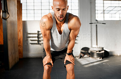 Buy stock photo Breathing, tired and fitness with African man on break from training, workout and exercise in gym. Sweating, health and wellness club with athlete and fatigue from endurance with rest and recovery