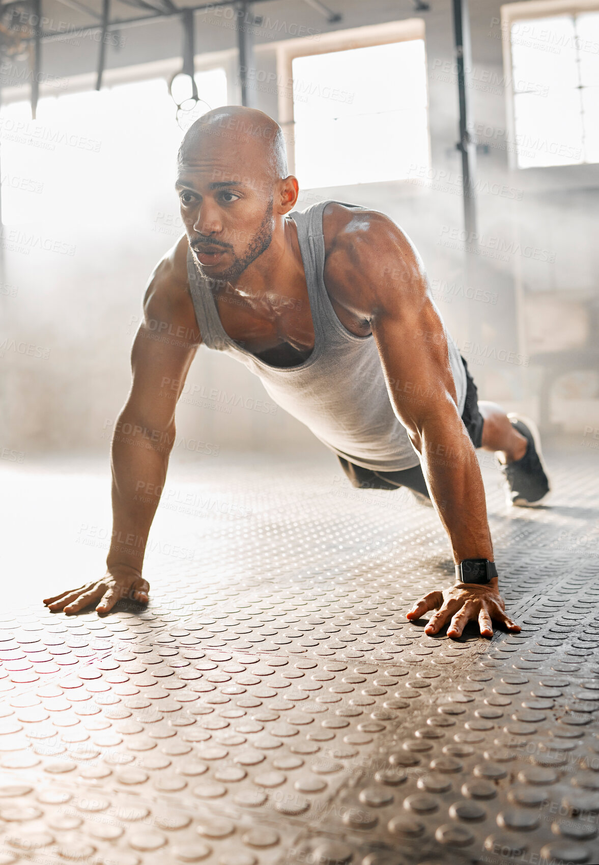 Buy stock photo Man, fitness and push ups with floor at gym for workout, exercise or intense training. Active, muscular or male person lifting body weight for muscle gain, strength or balance at indoor health club