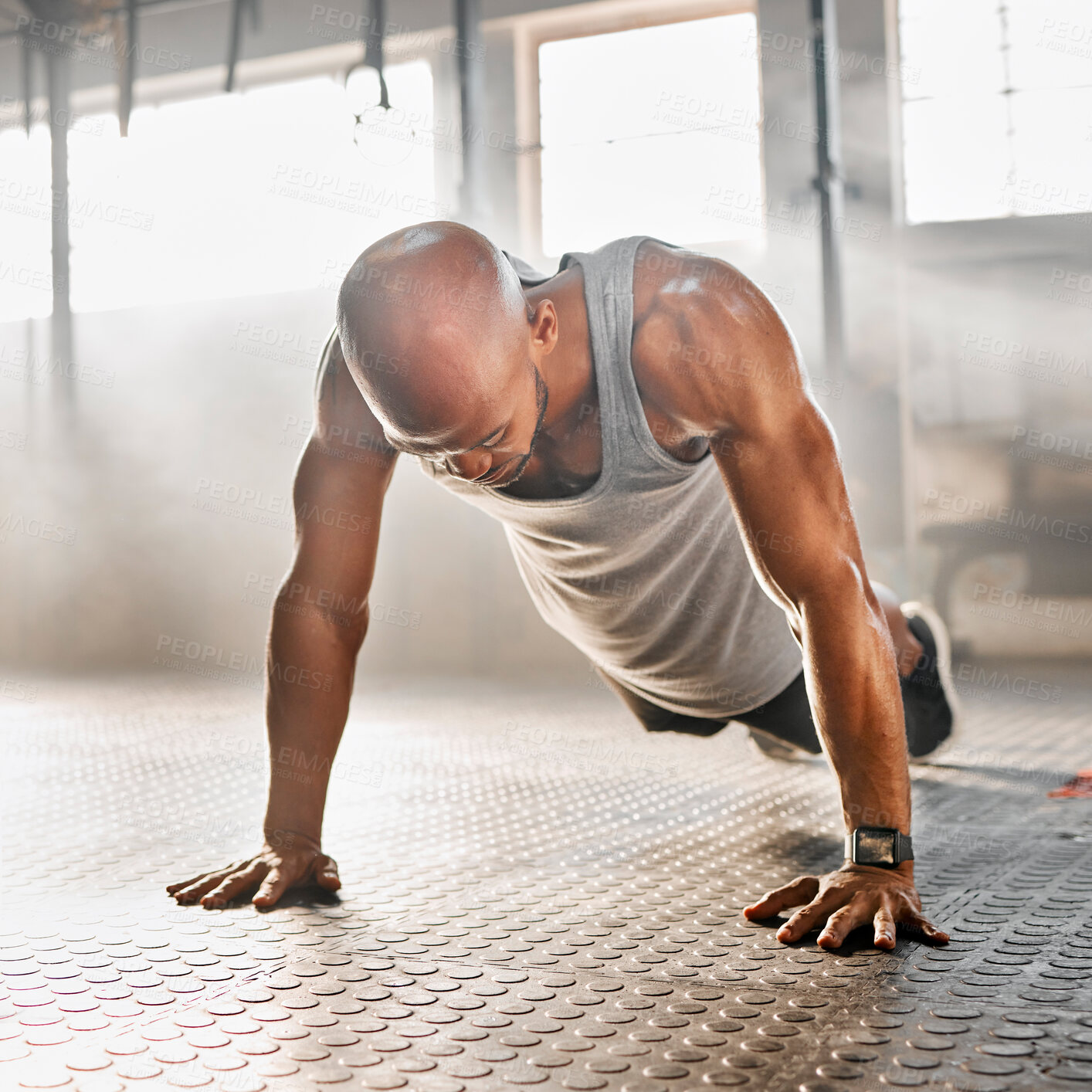 Buy stock photo Man, workout and push ups with floor at gym for exercise, fitness or intense training. Active, muscular or male person lifting body weight for muscle gain, strength or balance at indoor health club