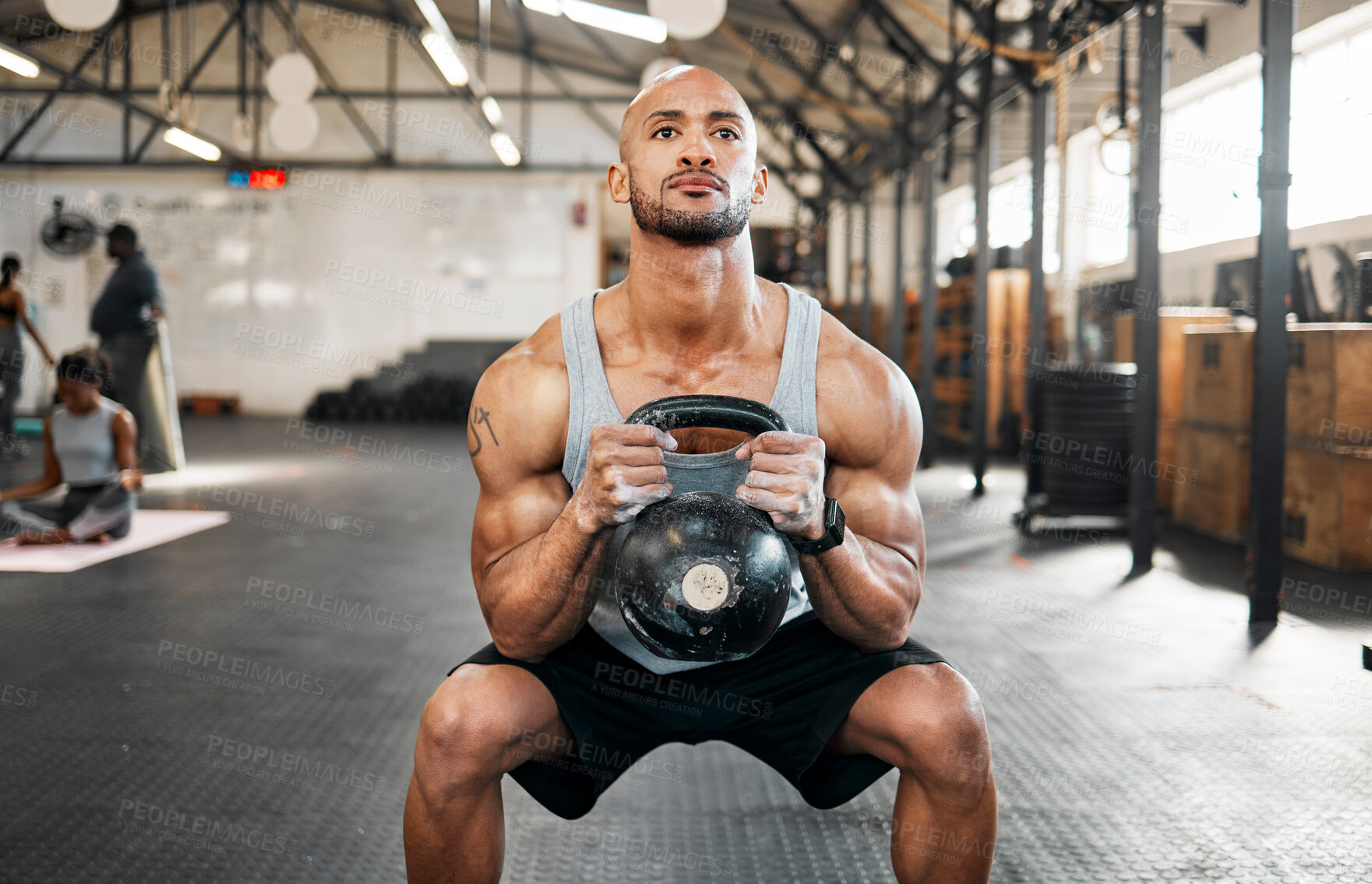 Buy stock photo Bodybuilder, man and squat for kettlebell, exercise or workout for arm strength at gym. Training, weights and sports athlete for weightlifting, muscle power and health club fitness performance