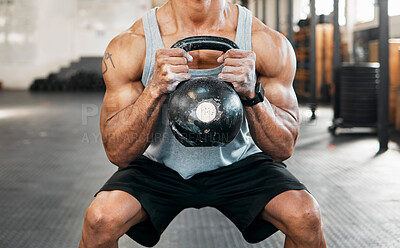 Buy stock photo Bodybuilder, hands and squat for kettlebell, exercise or workout for arm strength at gym. Man training, weights and sports athlete for weightlifting, muscle power and health club fitness performance