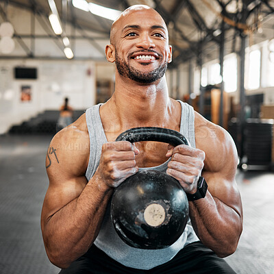 Buy stock photo Shot of a young man using a kettlebell during his workout