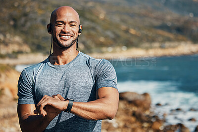 Buy stock photo Shot of a man using his watch to track his pulse while out for a workout