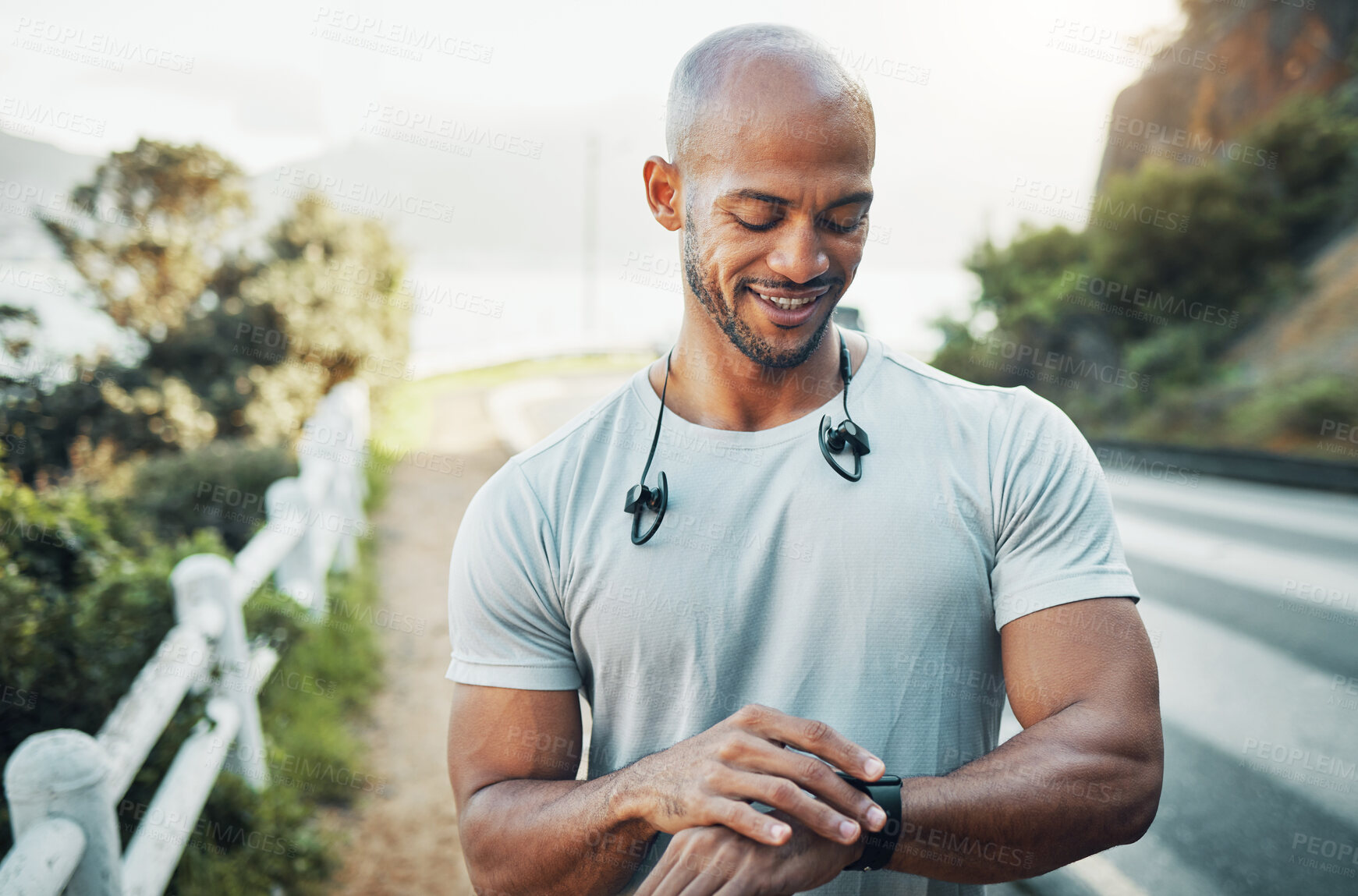 Buy stock photo Athlete, man and checking smart watch outdoor to monitor heart rate, running speed and fitness progress. Runner, person and happy with stopwatch in street for performance stats and exercise results