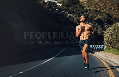 Buy stock photo Shot of a sporty young man running outdoors